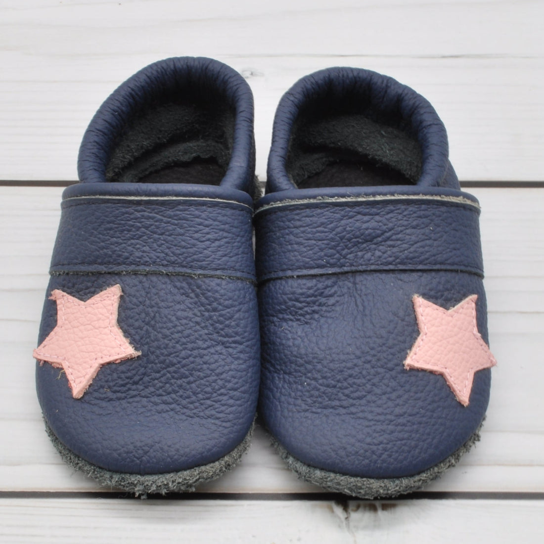 Krabbelschuhe in blau mit rosa Stern in Größe 20