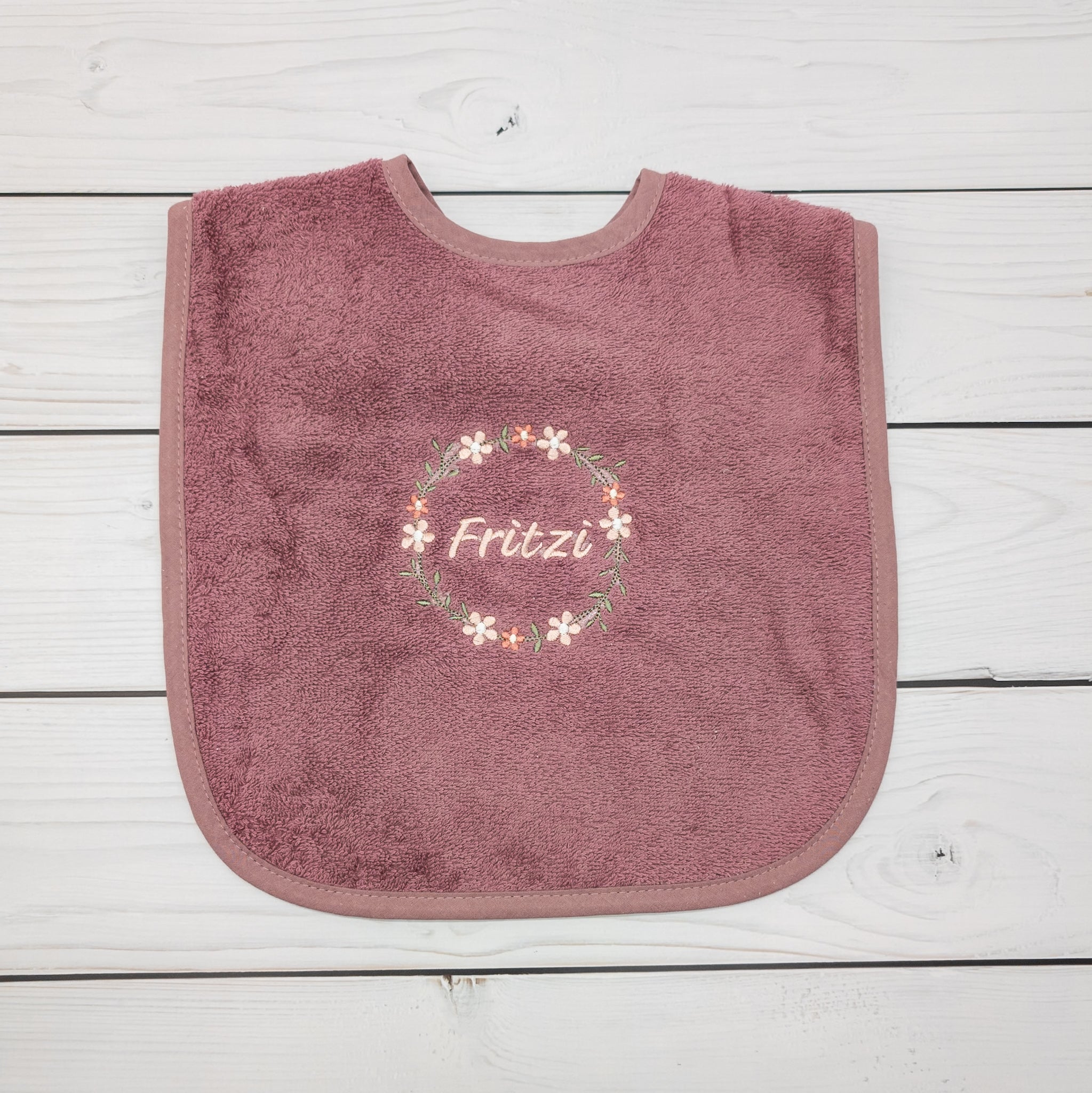 Lätzchen aus Frottee Blumenkranz und Name personalisiert
