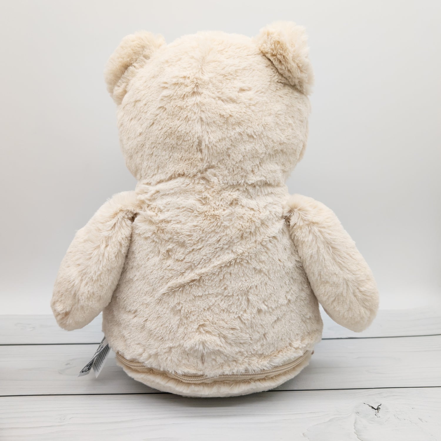Kuscheltier Bär mit Blumenkranz und Namen bestickt